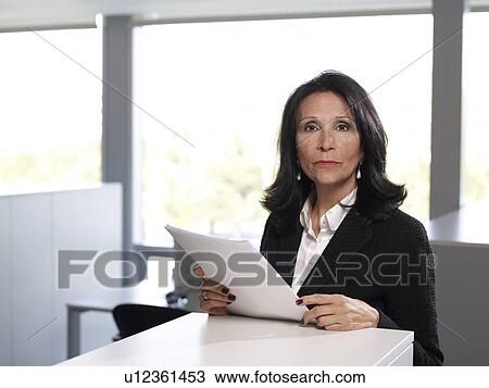 Stock Image - Senior businesswoman in office, portrait. Fotosearch