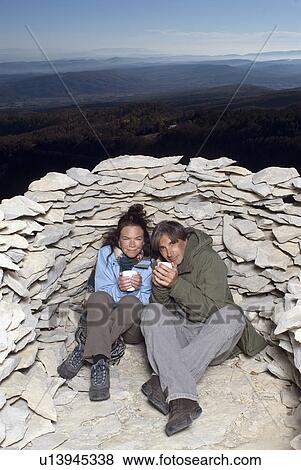 Couple having a hot drink. View Large Photo Image Stock Photo - Couple having a hot drink.. Fotosearch