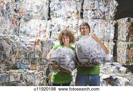 Man and woman at a recycling plant. View Large Photo Image Stock Photo - Man and woman at a recycling plant.. Fotosearch