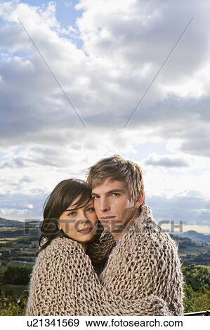 Man and woman wrapped in blanket. View Large Photo Image Stock Photo - Man and woman wrapped in blanket.. Fotosearch