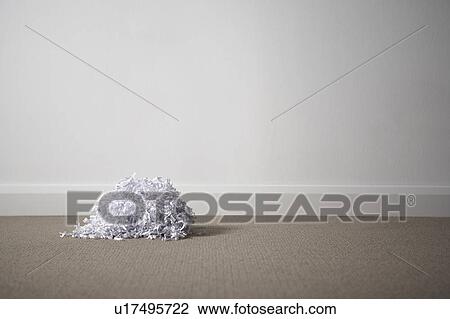 Stock Image - A pile of shredded paper on the floor.. Fotosearch