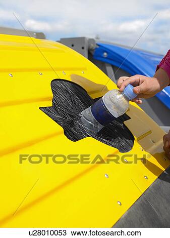 Close up of young girl's hand (5-7) placing plastic bottle in recycle bin, Alicante, Spain, View Large Photo Image Stock Image - Close up of young girl's hand (5-7) placing plastic bottle in recycle bin, Alicante, Spain,. Fotosearch