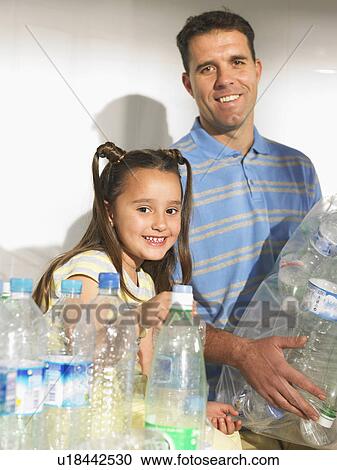 Father and daughter (6-8) recycling plastic bottles, smiling View Large Photo Image Stock Image - Father and daughter (6-8) recycling plastic bottles, smiling. Fotosearch