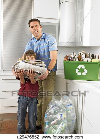 Father and son (6-8) in kitchen with recycling, smiling, portrait View Large Photo Image Stock Image - Father and son (6-8) in kitchen with recycling, smiling, portrait. Fotosearch