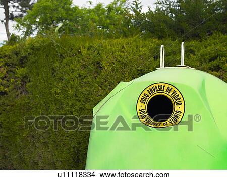 Green recycling bin by hedge, close crop, Alicante, Spain, View Large Photo Image Picture - Green recycling bin by hedge, close crop, Alicante, Spain,. Fotosearch