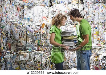 Man and woman at a recycling plant. View Large Photo Image Stock Image - Man and woman at a recycling plant.. Fotosearch