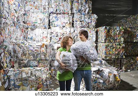 Man and woman at a recycling plant. View Large Photo Image Stock Image - Man and woman at a recycling plant.. Fotosearch