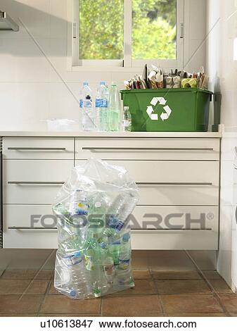 Stock Photo - Still life of recycling in a domestic kitchen, wide shot. Fotosearch