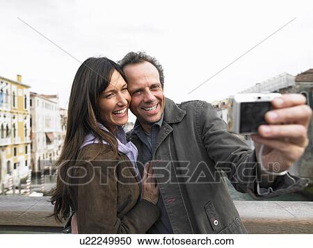 Couple taking self portrait on Academia Bridge. Grand Canal, Venice, Italy. View Large Photo Image Stock Image - Couple taking self portrait on Academia Bridge. Grand Canal, Venice, Italy.. Fotosearch