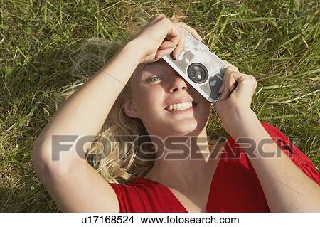 Young woman with fake toy camera. View Large Photo Image Picture - Young woman with fake toy camera.. Fotosearch