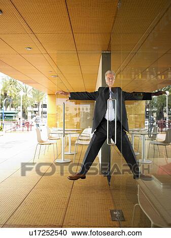 Man half in half out of doorway. View Large Photo Image Stock Image - Man half in half out of doorway.. Fotosearch