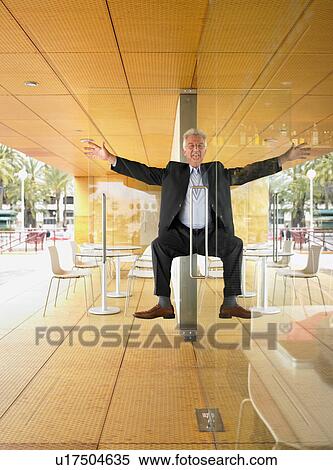 Man half in half out of doorway. View Large Photo Image Stock Photography - Man half in half out of doorway.. Fotosearch