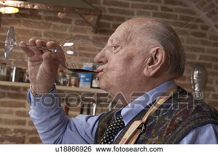 Senior man drinking red wine View Large Photo Image Stock Photograph - Senior man drinking red wine. Fotosearch
