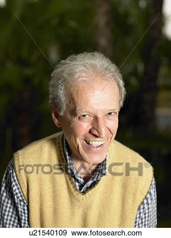 Senior man in garden, smiling, portrait View Large Photo Image Stock Photo - Senior man in garden, smiling, portrait. Fotosearch