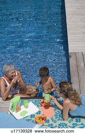 Stock Photo - Woman and boy in swimming pool.. Fotosearch