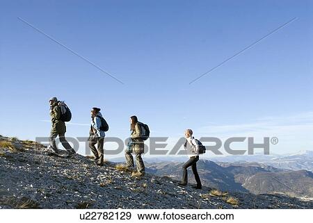 4 people on a trek. View Large Photo Image Stock Photo - 4 people on a trek.. Fotosearch