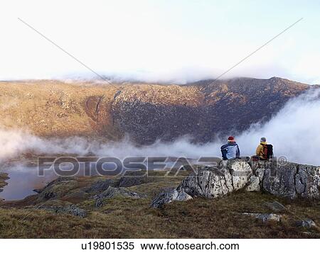 Stock Photography - Couple in mountain landscape.. Fotosearch