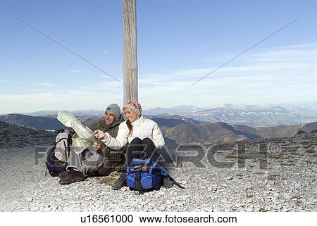 Couple looking at a map. View Large Photo Image Stock Image - Couple looking at a map.. Fotosearch