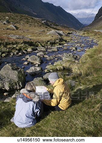 Stock Image - Couple with map.. Fotosearch