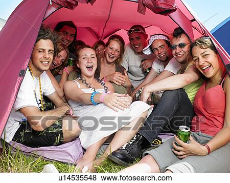 Stock Photo - Group of people in tent. Fotosearch