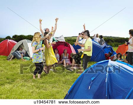 Group partying outside tents View Large Photo Image Stock Image - Group partying outside tents. Fotosearch
