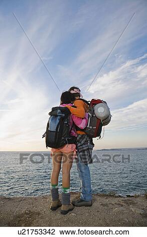 Man and woman looking out to sea. View Large Photo Image Stock Image - Man and woman looking out to sea.. Fotosearch