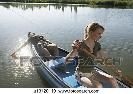 Two young women in Canoe. View Large Photo Image Stock Photo - Two young women in Canoe.. Fotosearch