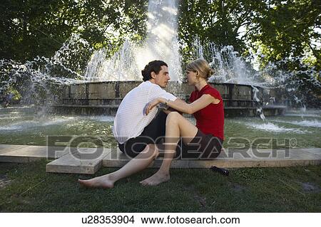 Couple by fountain. View Large Photo Image Picture - Couple by fountain.. Fotosearch
