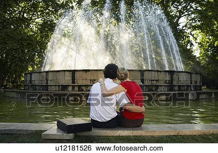 Couple by fountain. View Large Photo Image Stock Photograph - Couple by fountain.. Fotosearch