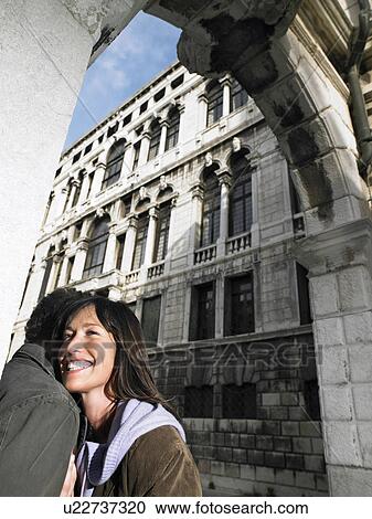 Couple embracing under stone arch. Venice, Italy. View Large Photo Image Stock Image - Couple embracing under stone arch. Venice, Italy.. Fotosearch