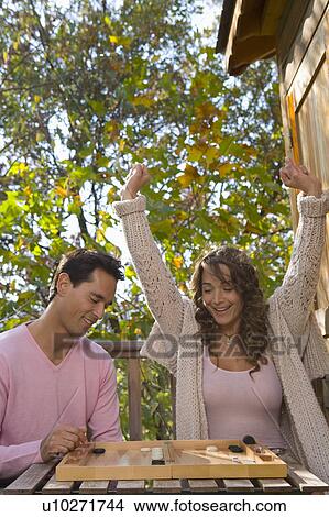 Couple playing game tree house. View Large Photo Image Picture - Couple playing game tree house.. Fotosearch