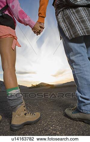 Man and woman holding hands. View Large Photo Image Stock Image - Man and woman holding hands.. Fotosearch