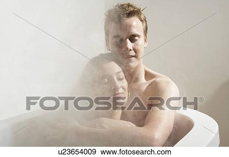 Stock Photo - Man and woman in a bath.. Fotosearch
