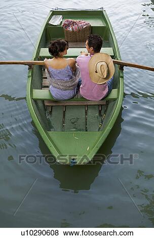 Man and woman in a boat View Large Photo Image Stock Photo - Man and woman in a boat. Fotosearch
