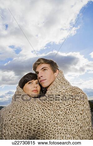 Man and woman wrapped in blanket. View Large Photo Image Stock Photography - Man and woman wrapped in blanket.. Fotosearch
