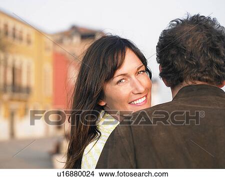 Rear view of couple, woman turning back. Venice, Italy. View Large Photo Image Picture - Rear view of couple, woman turning back. Venice, Italy.. Fotosearch