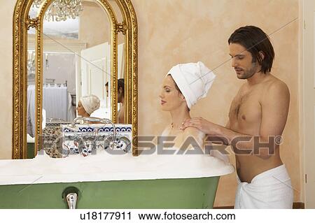 young man massaging shoulders of woman in bath with eyes closed View Large Photo Image Stock Image - young man massaging shoulders of woman in bath with eyes closed. Fotosearch