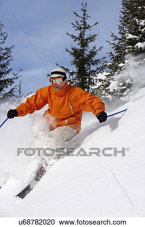 Austria, Saalbach, male skier turning in snow on slope View Large Photo Image Stock Image - Austria, Saalbach, male skier turning in snow on slope. Fotosearch