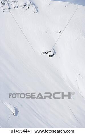 Austria, Saalbach, man snowboarding down slope, elevated view View Large Photo Image Stock Image - Austria, Saalbach, man snowboarding down slope, elevated view. Fotosearch