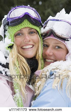 Close-up of two young blonde women in ski-wear embracing View Large Photo Image Stock Image - Close-up of two young blonde women in ski-wear embracing. Fotosearch