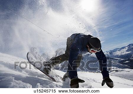 Male snowboarder falling over on mountain View Large Photo Image Stock Photography - Male snowboarder falling over on mountain. Fotosearch