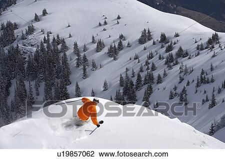 Man skiing down snow mountain slope, overhead view View Large Photo Image Stock Image - Man skiing down snow mountain slope, overhead view. Fotosearch