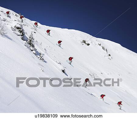 Stock Photo - Sequence of male skier jumping down steep slope (Digital Composite). Fotosearch