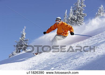 Austria, Saalbach, man skiing down slope View Large Photo Image Stock Image - Austria, Saalbach, man skiing down slope. Fotosearch