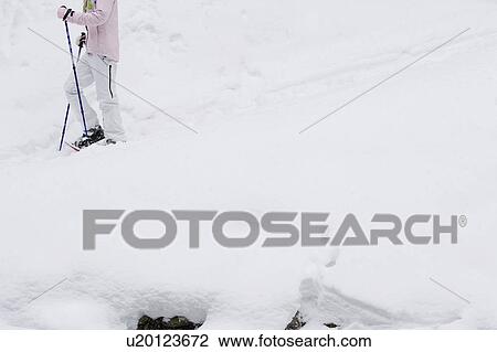 Low section side view of young woman walking in snow-shoes View Large Photo Image Stock Image - Low section side view of young woman walking in snow-shoes. Fotosearch