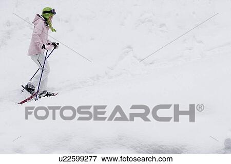 Side view of young blonde woman walking in snow-shoes, side-view View Large Photo Image Stock Photo - Side view of young blonde woman walking in snow-shoes, side-view. Fotosearch