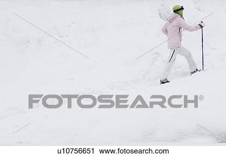 Side view of young woman walking in snow-shoes, side-view View Large Photo Image Stock Image - Side view of young woman walking in snow-shoes, side-view. Fotosearch