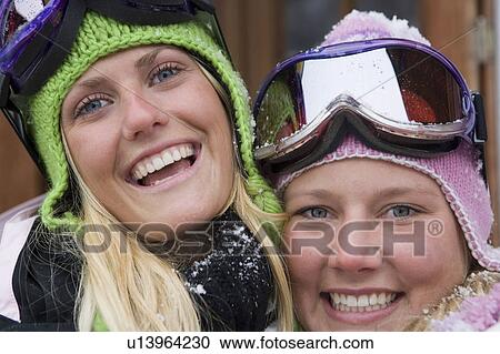 Two young blonde women in ski-wear, close-up, portrait View Large Photo Image Stock Image - Two young blonde women in ski-wear, close-up, portrait. Fotosearch