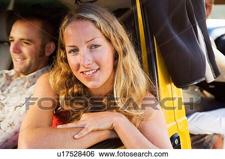 Couple in a van smiling. View Large Photo Image Stock Photograph - Couple in a van smiling.. Fotosearch