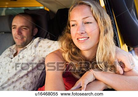 Couple in a van smiling. View Large Photo Image Stock Photography - Couple in a van smiling.. Fotosearch